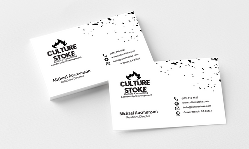 Two white business cards with black Culture Stoke logos, contact information and scattered black marks, shown on a pale background.