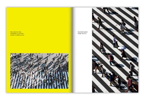 Two-page editorial spread with a yellow text panel and crowd photograph on the left, and an overhead photograph of pedestrians on a striped crosswalk on the right.