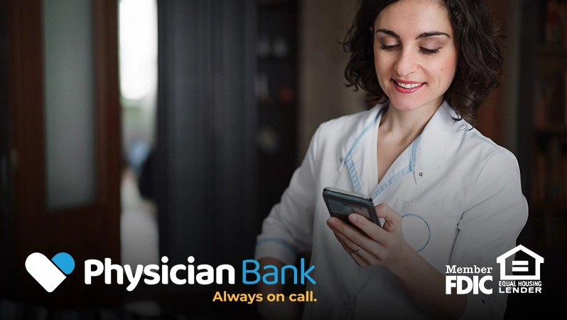 image of a female doctor looking at her phone