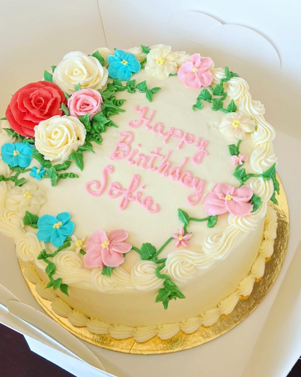 Bridgette's real birthday cake for Sofia, decorated with hand-piped flowers