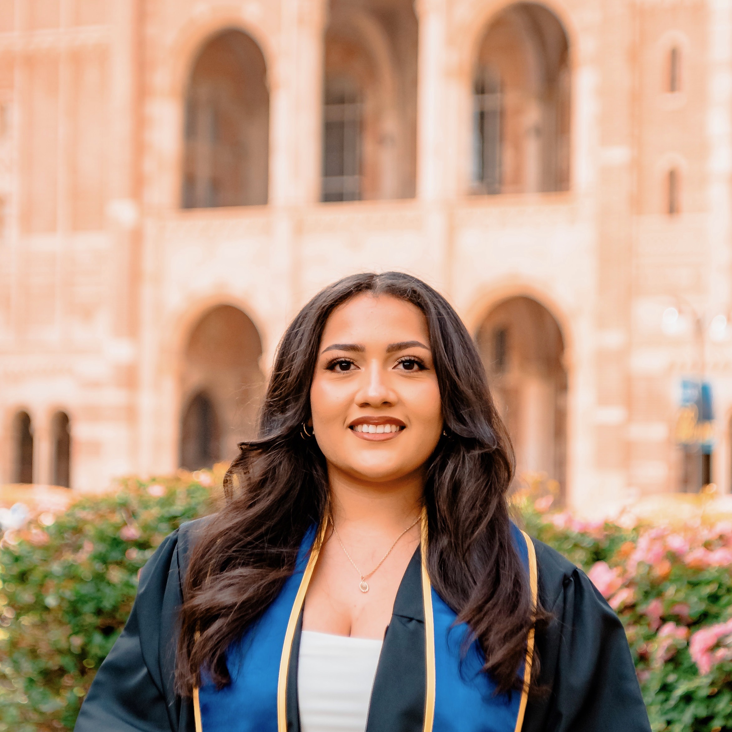 Yuricela Rosas in graduation regalia at Harvard Graduate School of Education