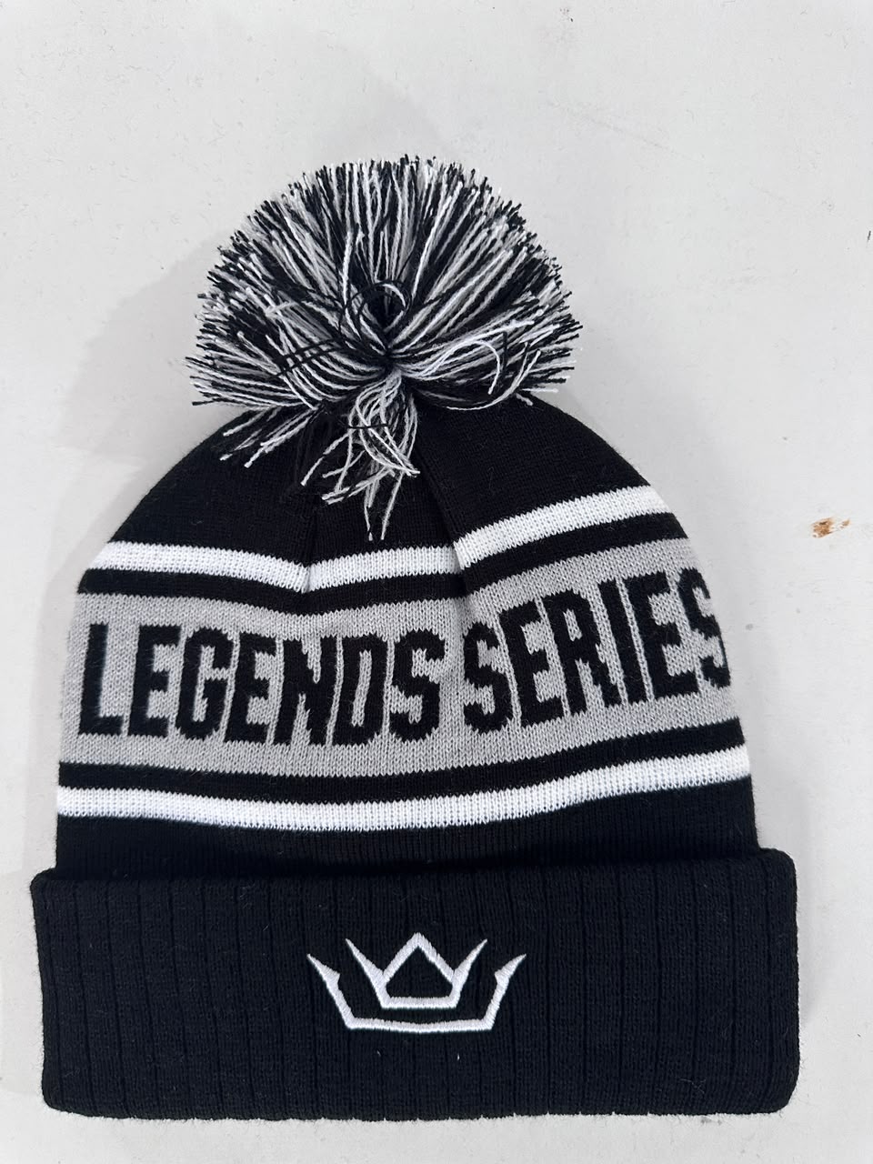 Custom black Legends Series bobble hat with embroidered crown logo