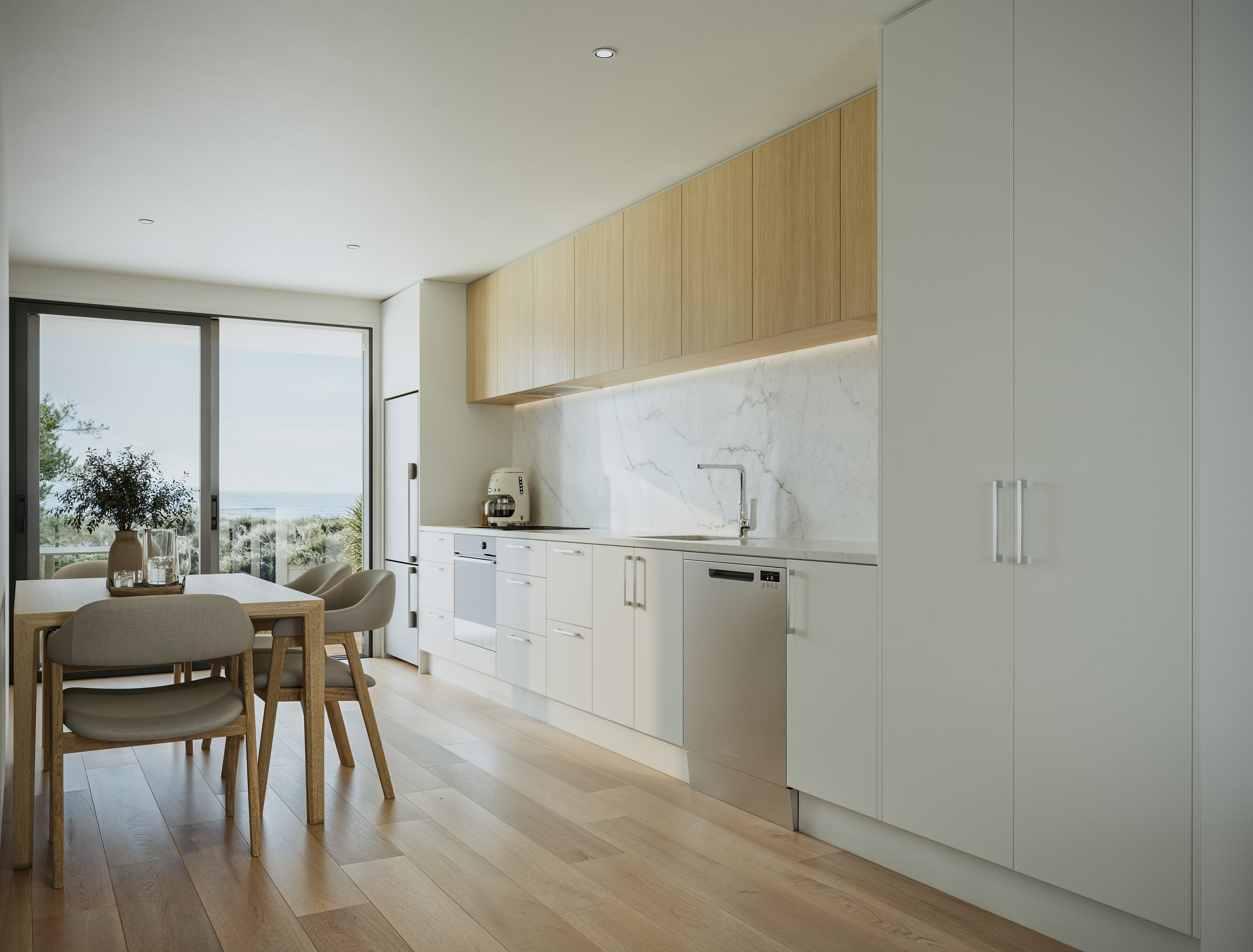 Artist's impression of the Seaside Place kitchen, with timber upper cabinetry, marble splashback, white cabinetry, stainless steel appliances, light oak flooring and a view of the ocean from the dining area