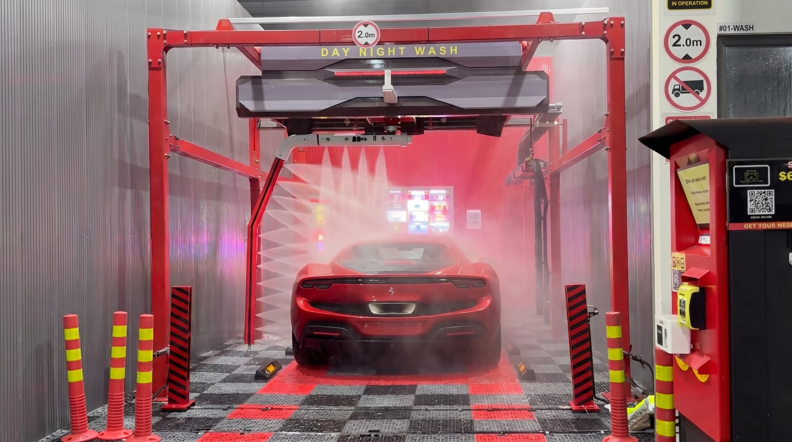 High-pressure jets rinsing a car in an automated wash bay