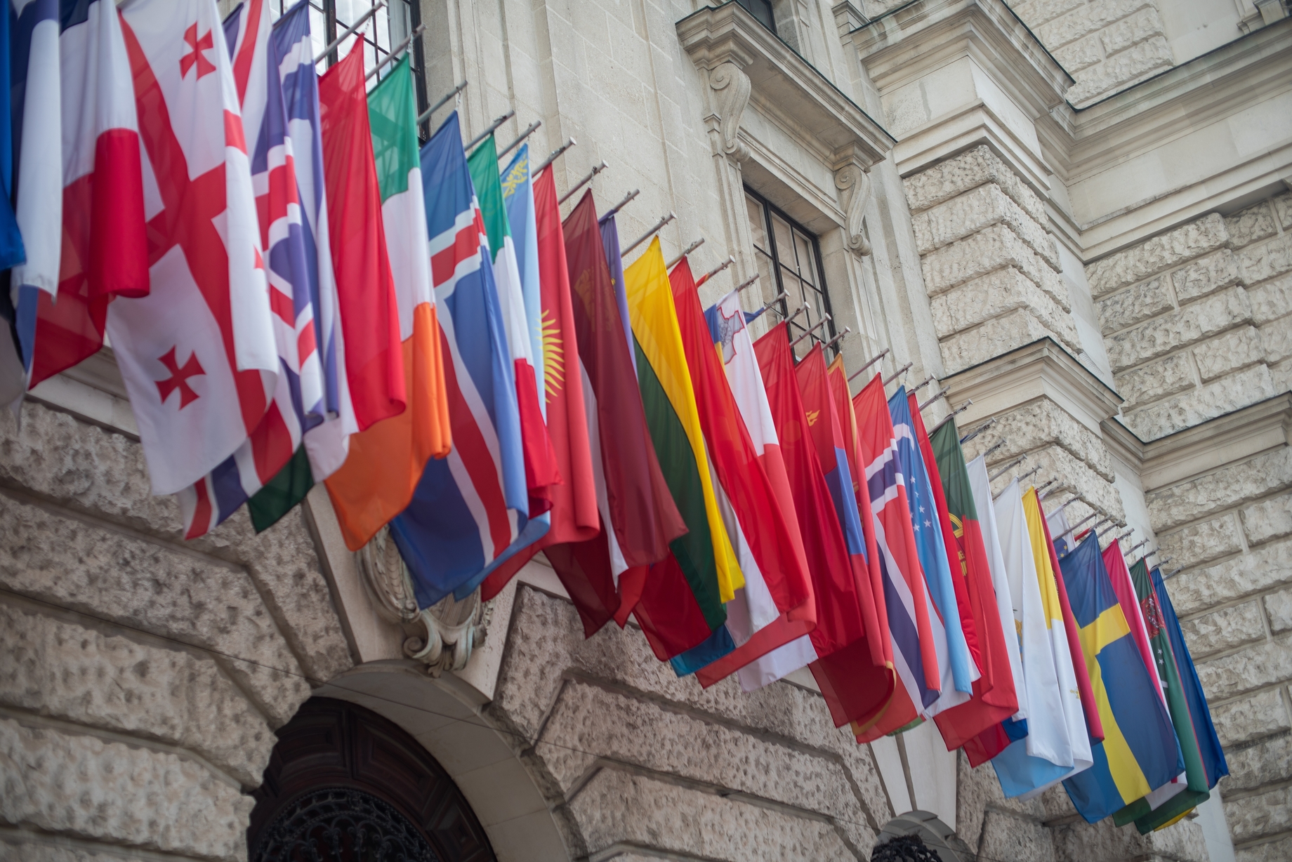 Flags displayed on European building
