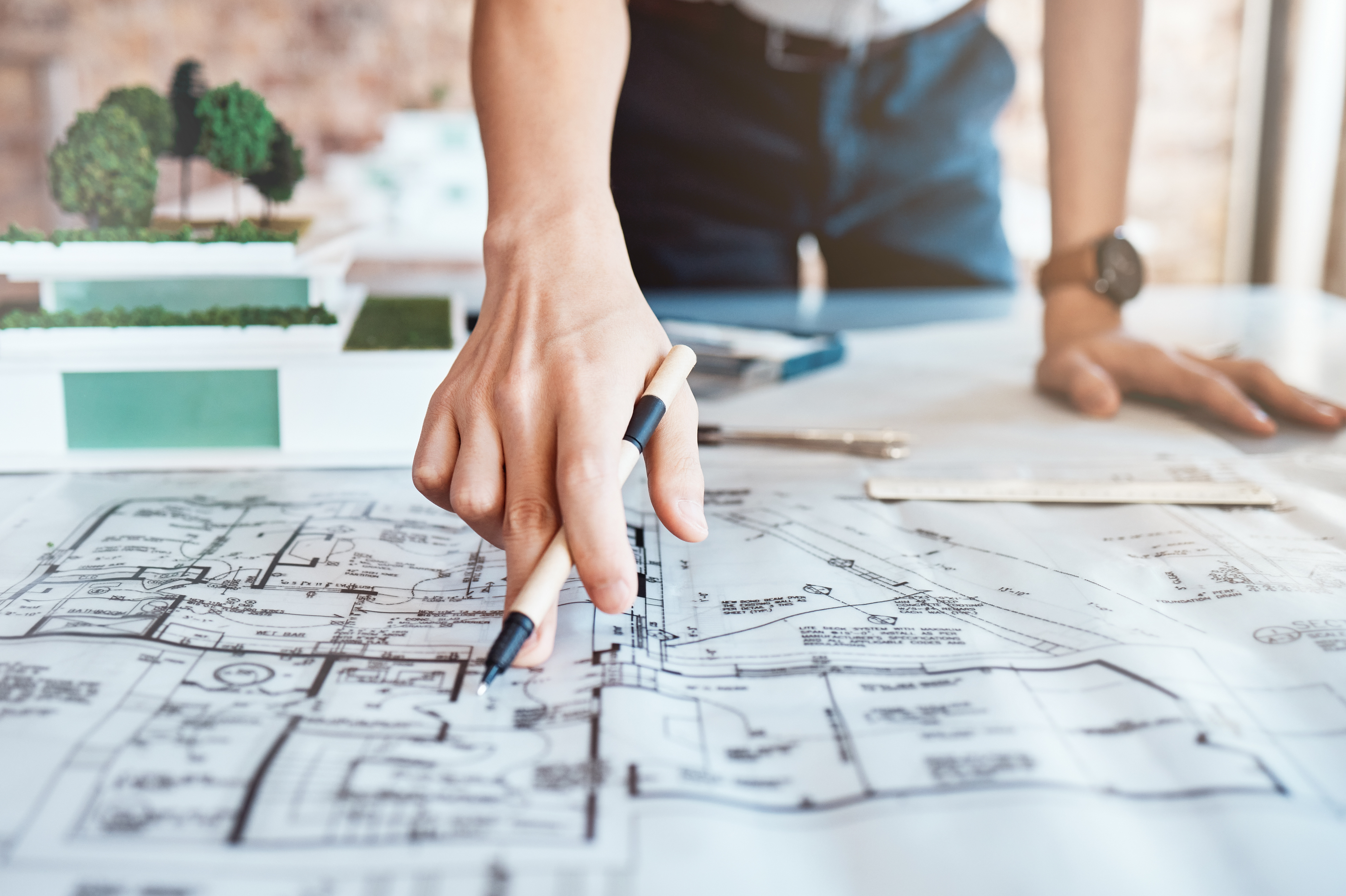 Construction professional reviewing detailed plans