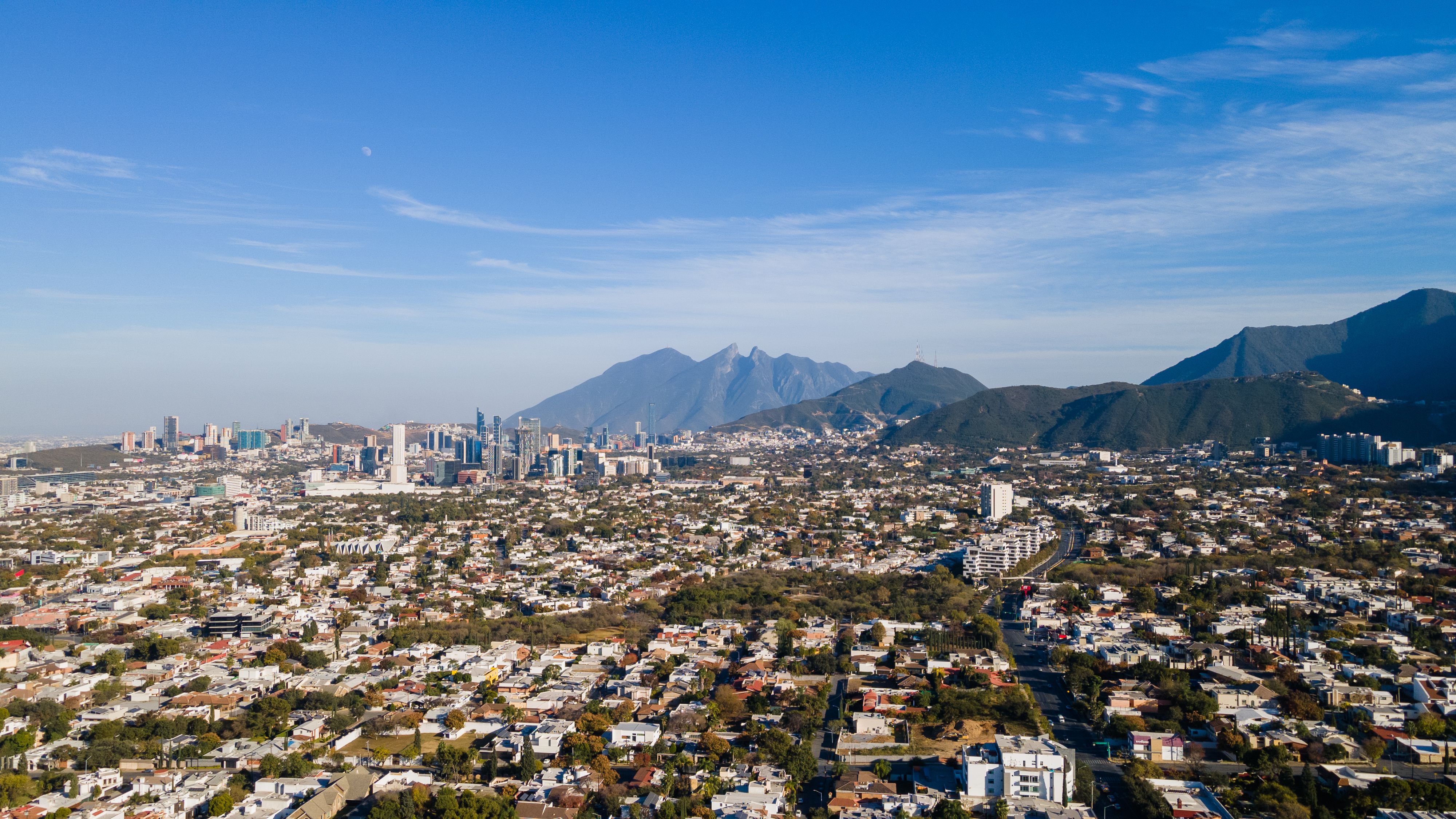 Aerial view of Monterrey skyline with the iconic Cerro de la Silla mountain in the background
