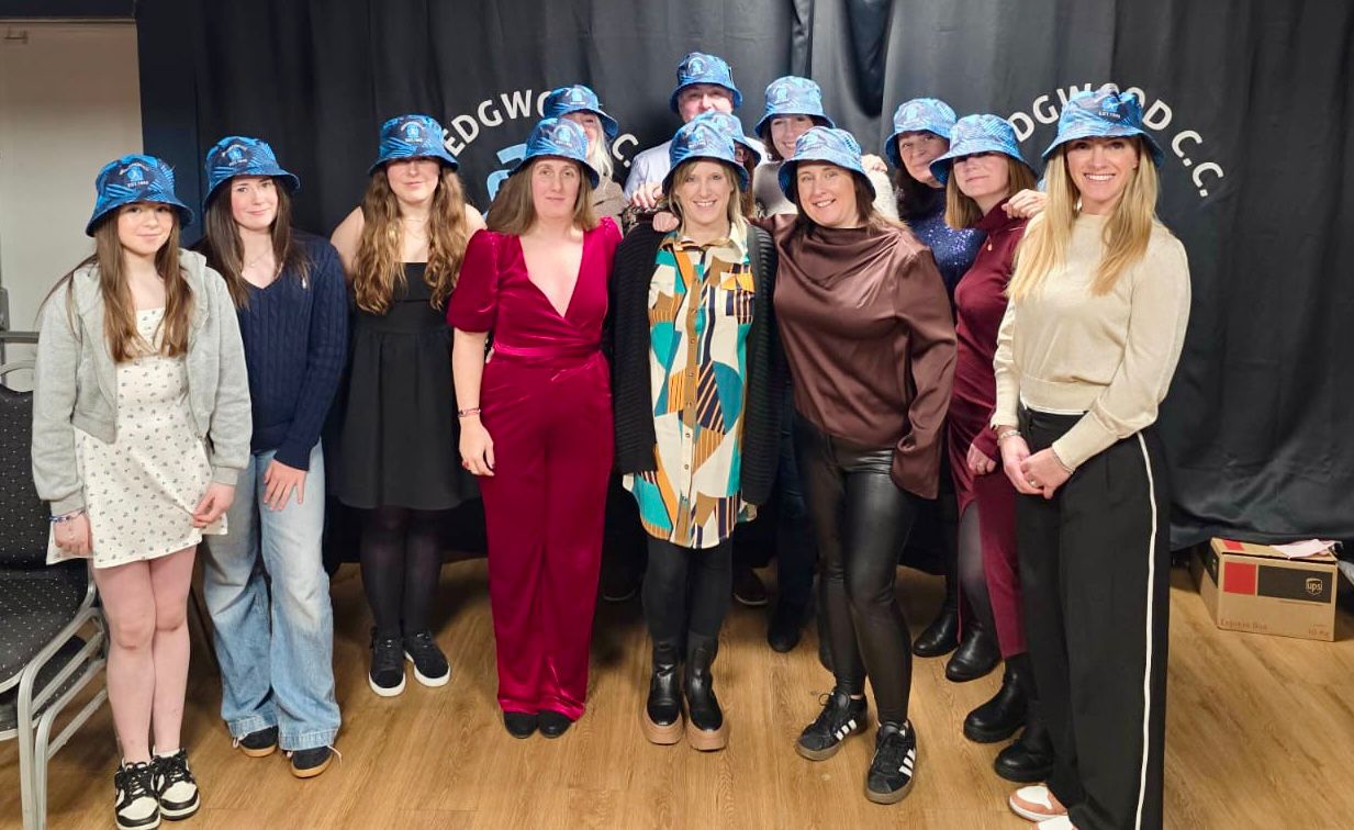 Group of members wearing custom Wedgwood C.C. bucket hats