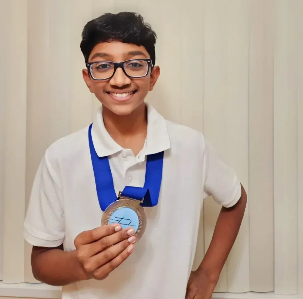 Sanjay, Grade 6 MathFit Kid with US President's Education Award medal