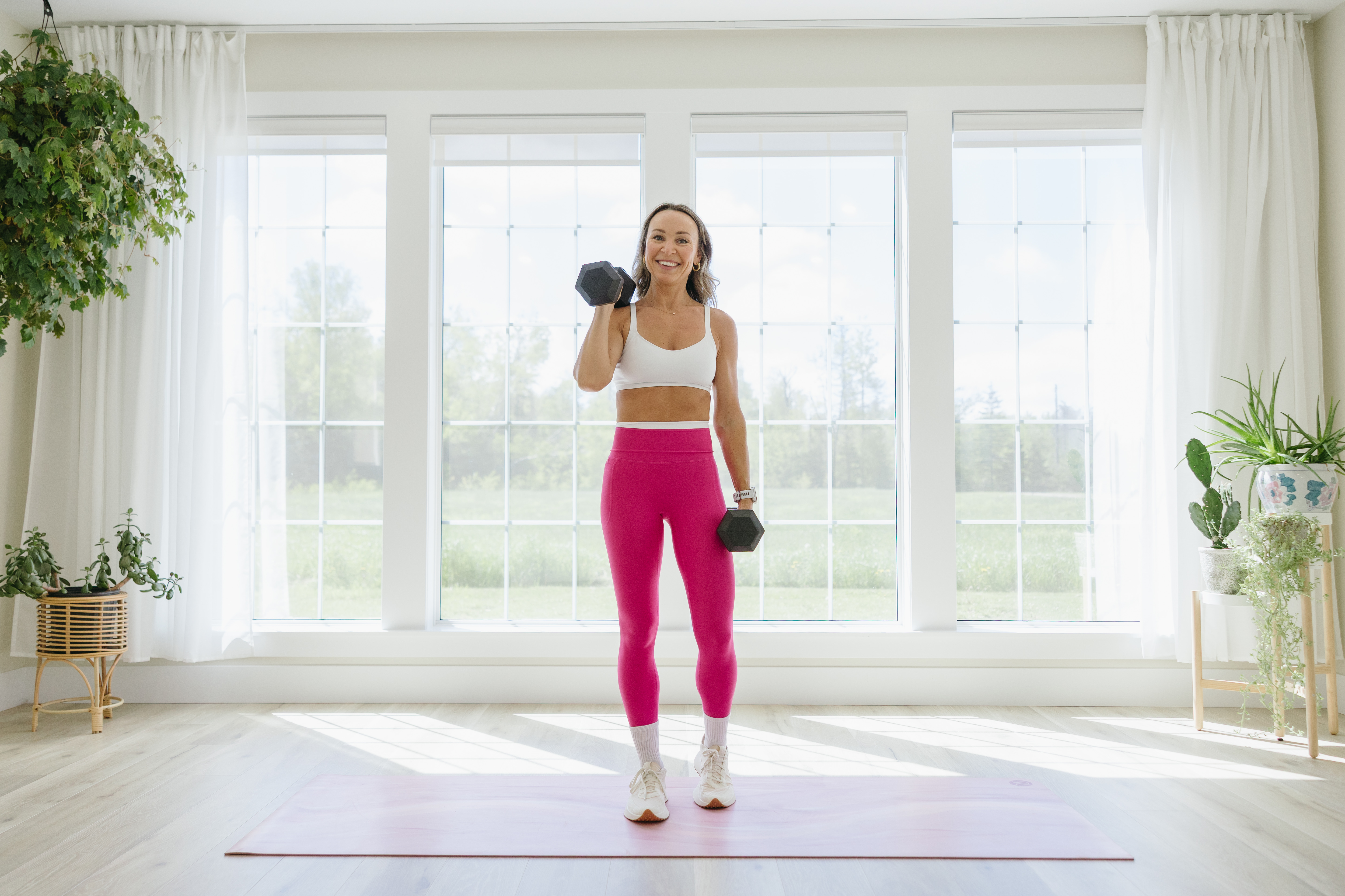 Woman in her 40s strength training at home