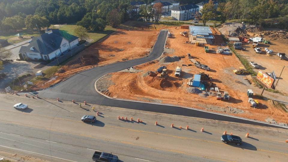Newly paved private community road with fresh asphalt