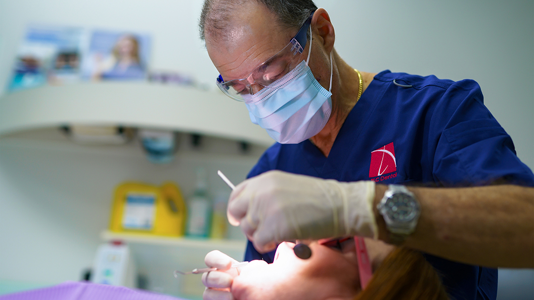 Dr Leonard Hoffenberg treating a patient at TLC Dental Sydney