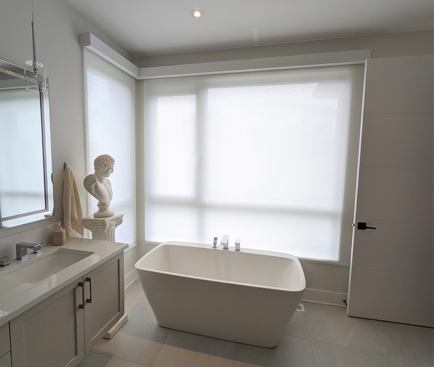 Master bathroom with custom cellular shades covering the window