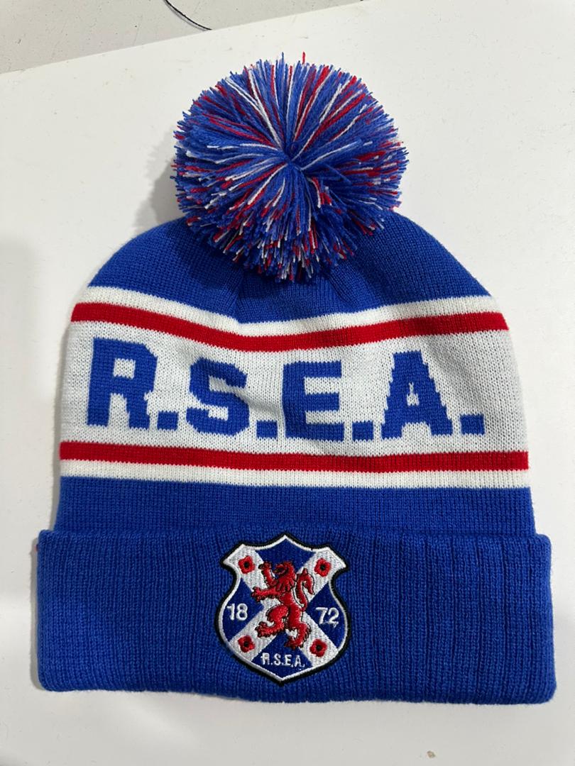 RSEA custom royal blue, red and white bobble hat with R.S.E.A. knitted band and 1872 rampant lion shield