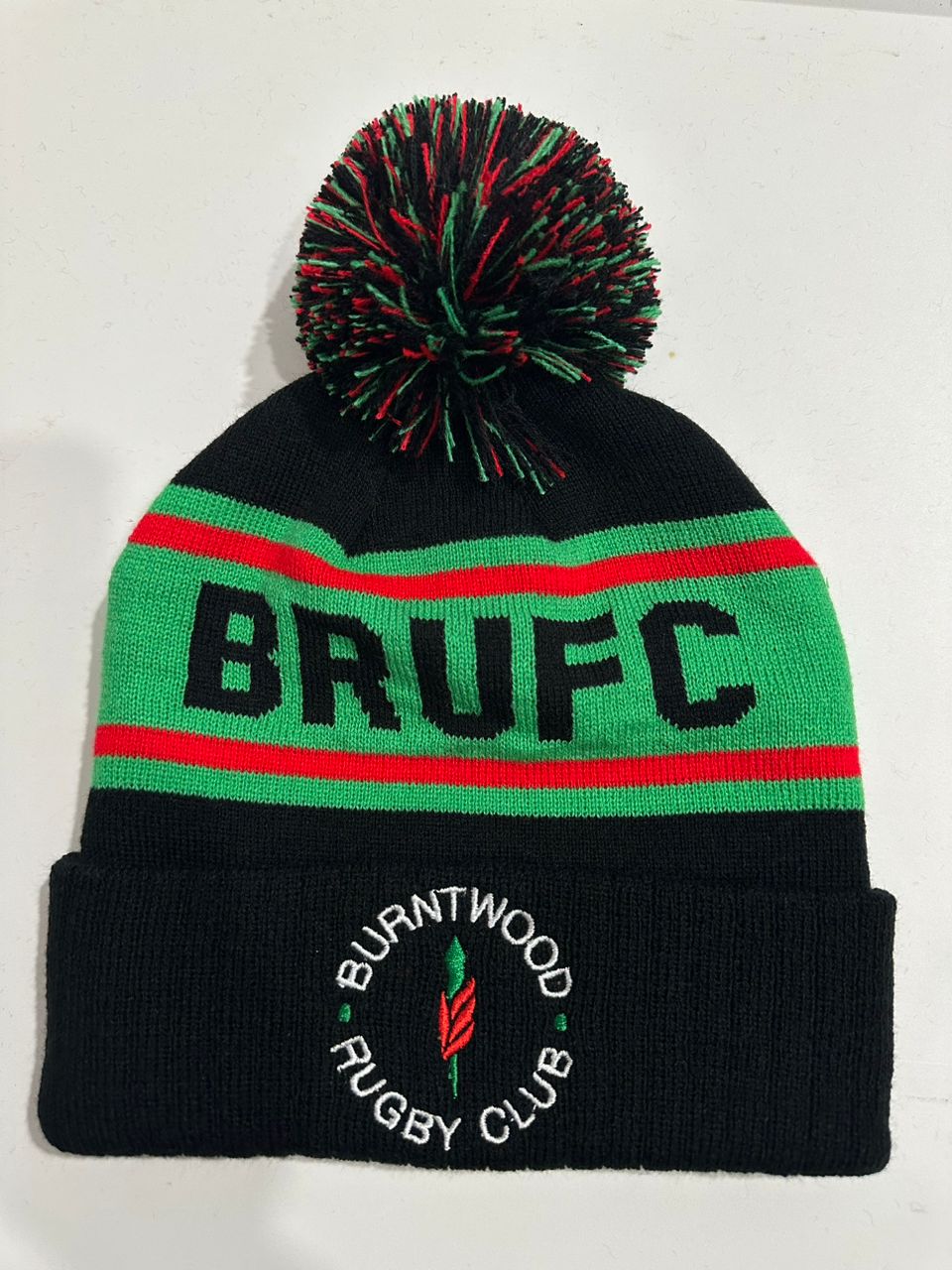 Burntwood RFC custom black, green and red bobble hat with B.R.U.F.C. knitted band and Burntwood Rugby Club round patch