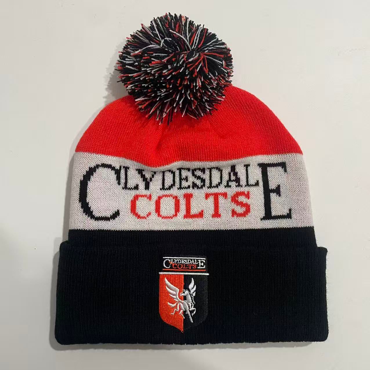 Clydesdale Colts custom red, white and black bobble hat with CLYDESDALE COLTS knitted text and Clydesdale Colts shield patch