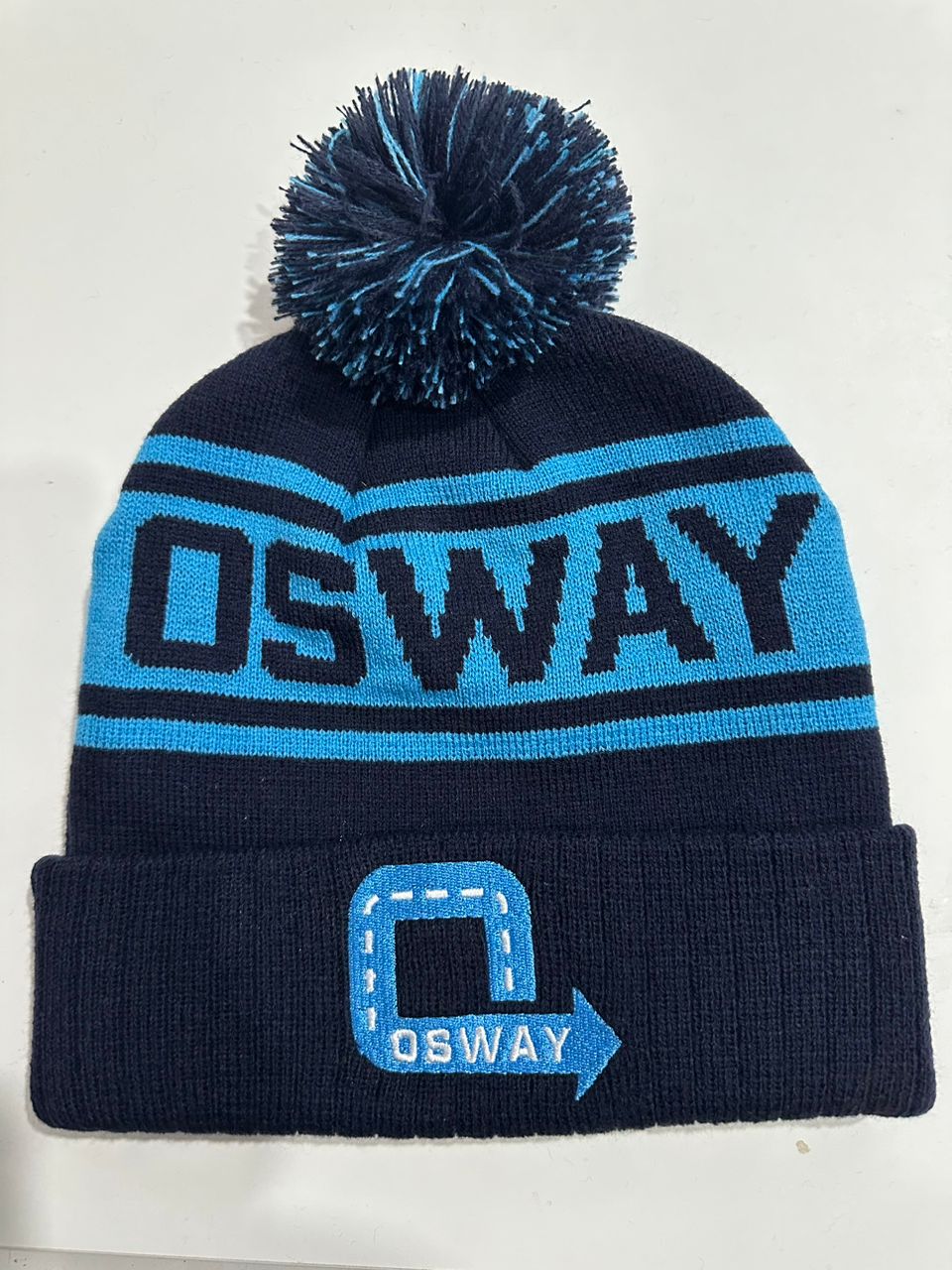 OSWAY custom navy and light blue bobble hat with knitted OSWAY band and logo patch