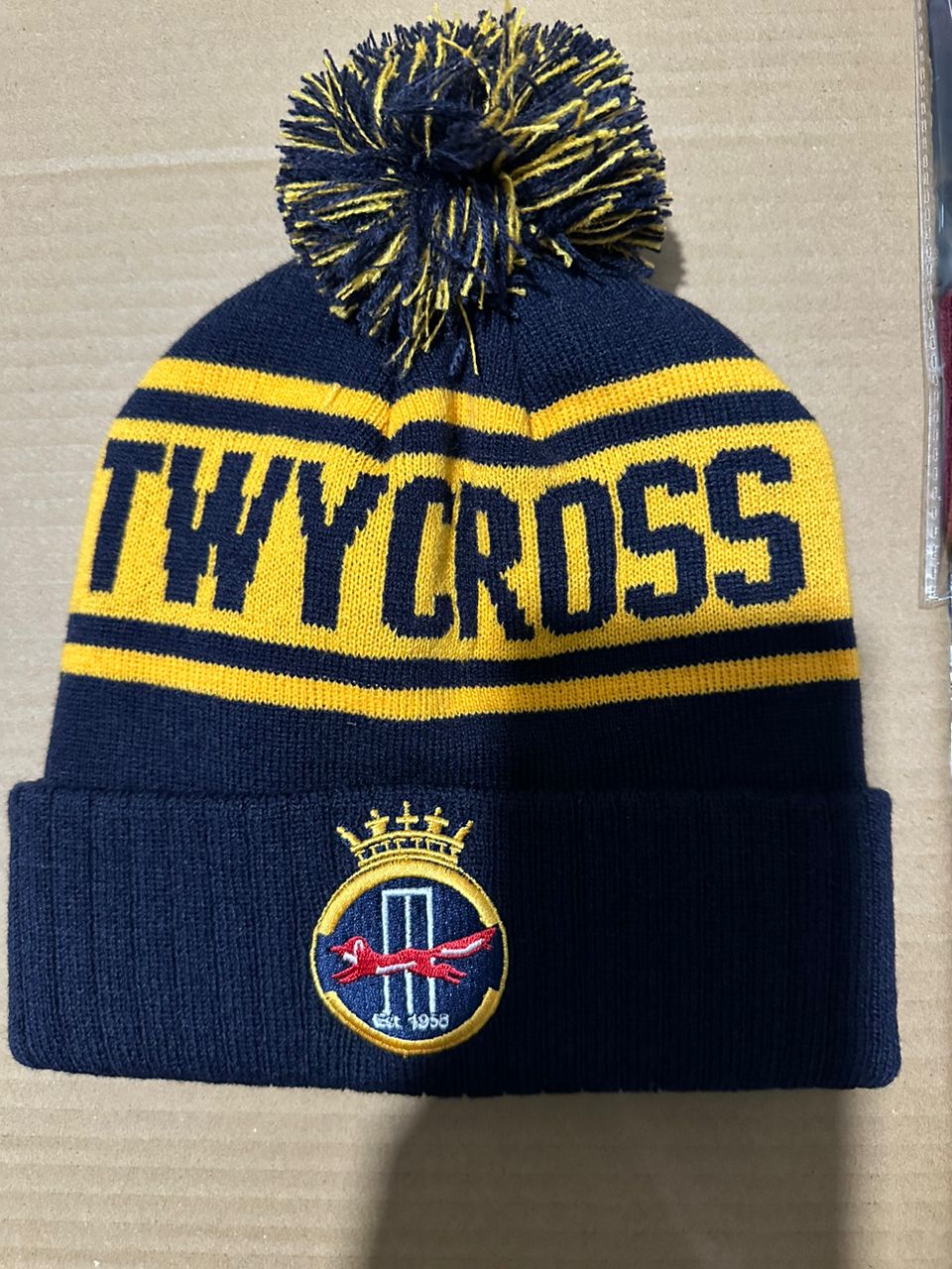 Thycoss custom navy and yellow bobble hat with Est 1958 club badge