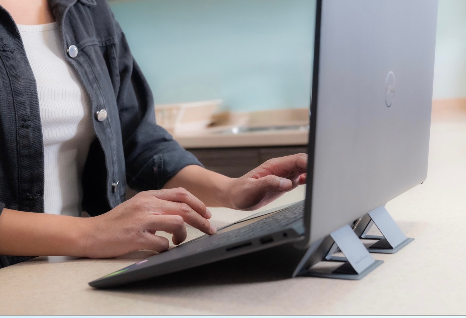 MagShift supporting a laptop in a real workspace