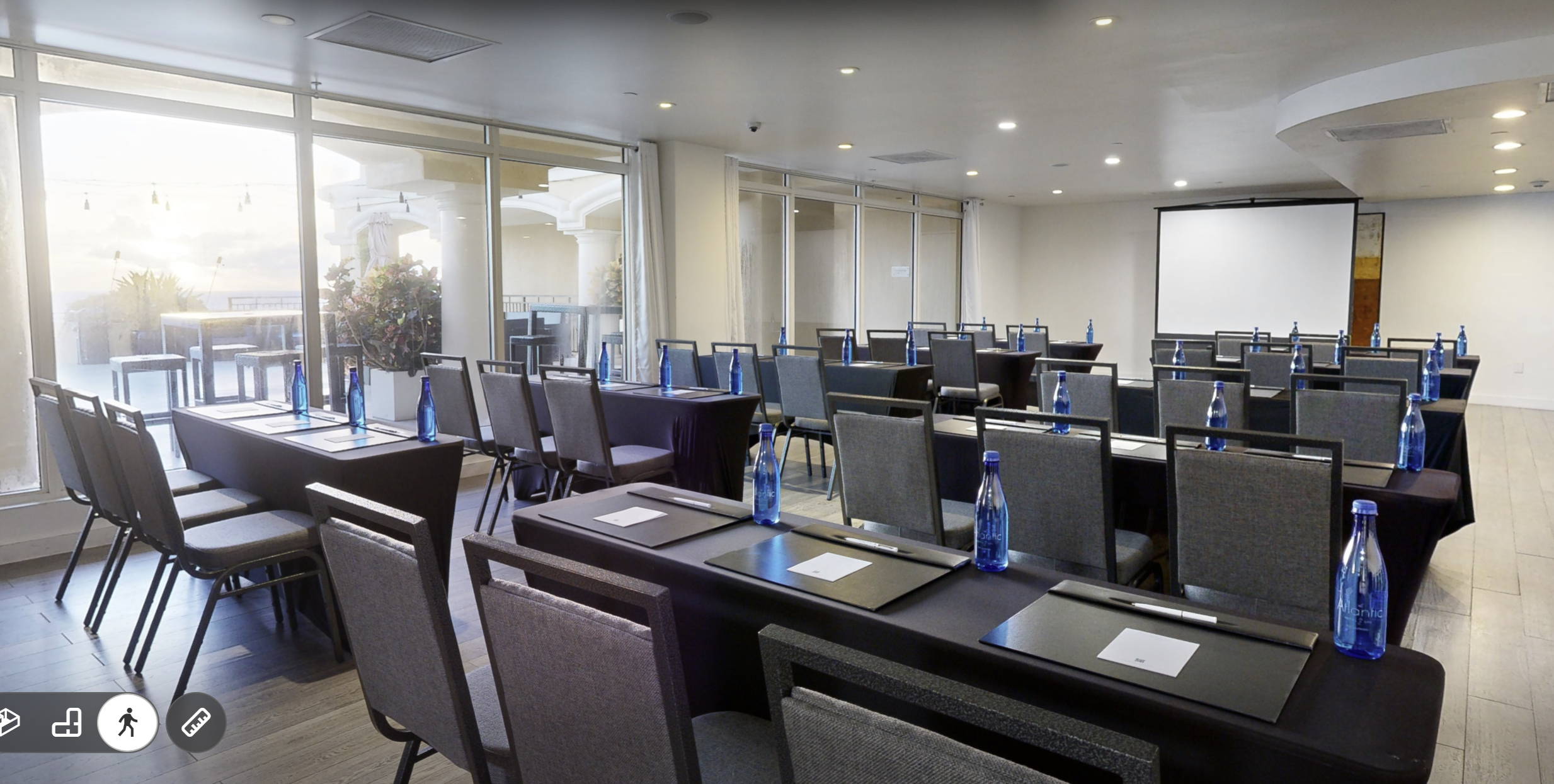 Oceanview classroom-style meeting space with Atlantic Hotel & Spa projection screen