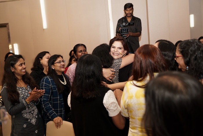 Shruti Chaudhary hugging event participants