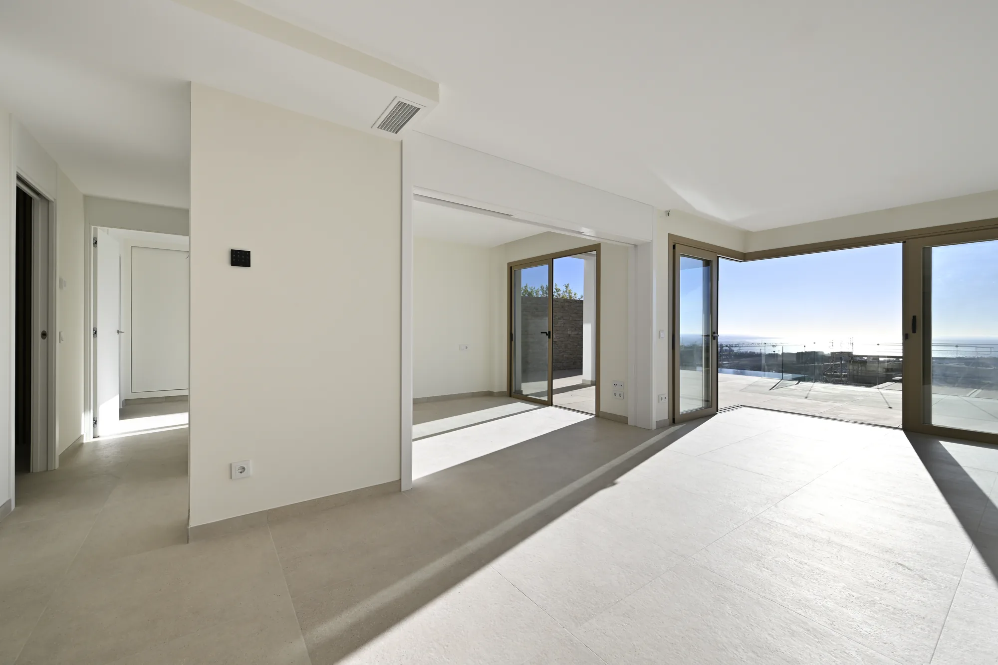 Light-filled living room opening to the Mediterranean