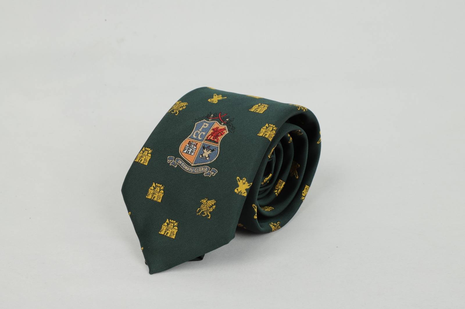 PCC Cricket Club custom green tie with gold castle pattern and heritage badge