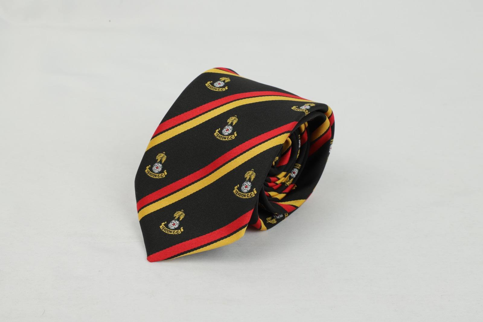 Custom black tie with red and yellow diagonal stripes and Yeadon Cricket Club badge