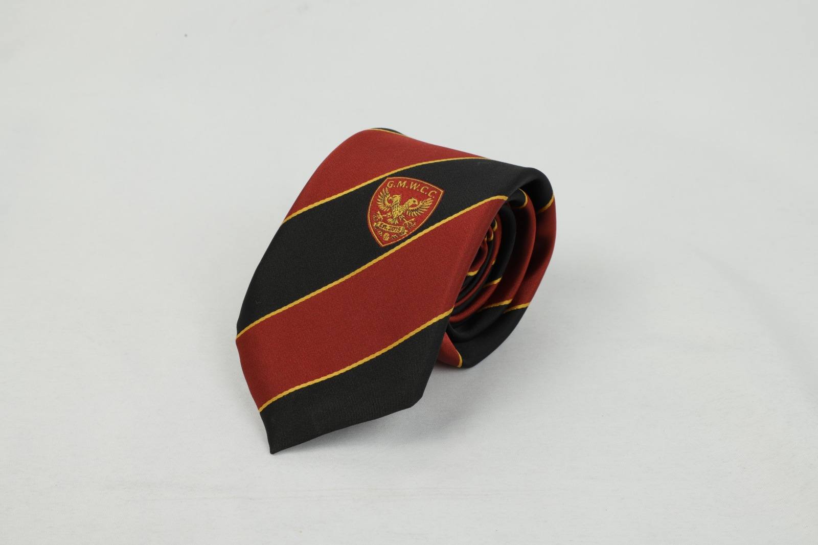Custom red and black striped tie with G.M.W.C.C. badge and griffin crest