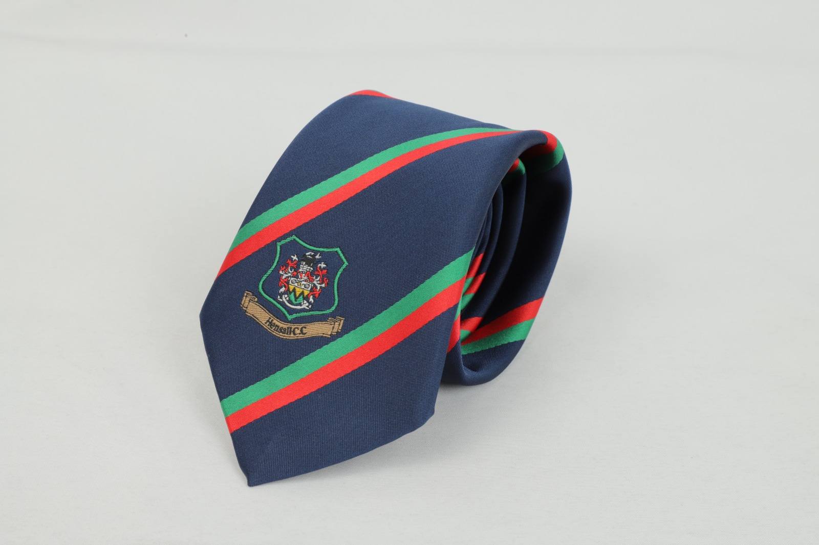 Custom navy tie with red and green stripes and Hensall Cricket Club badge