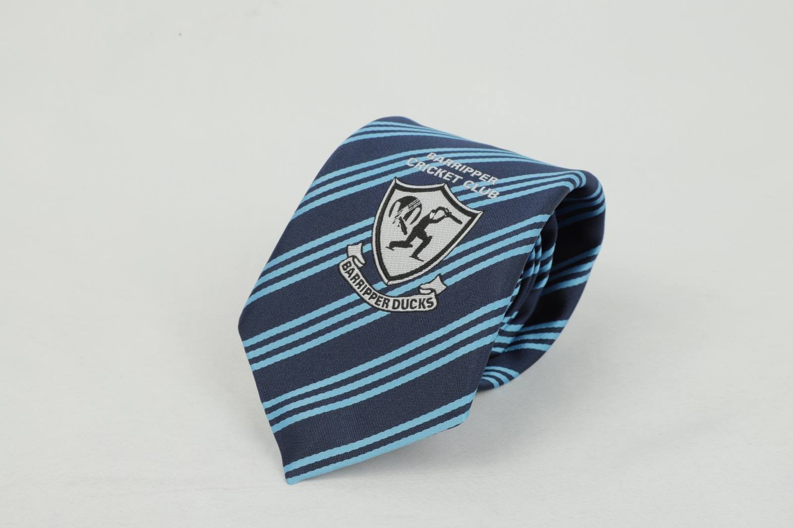 Custom navy and light blue striped tie with Barripper Cricket Club Badripper Ducks badge