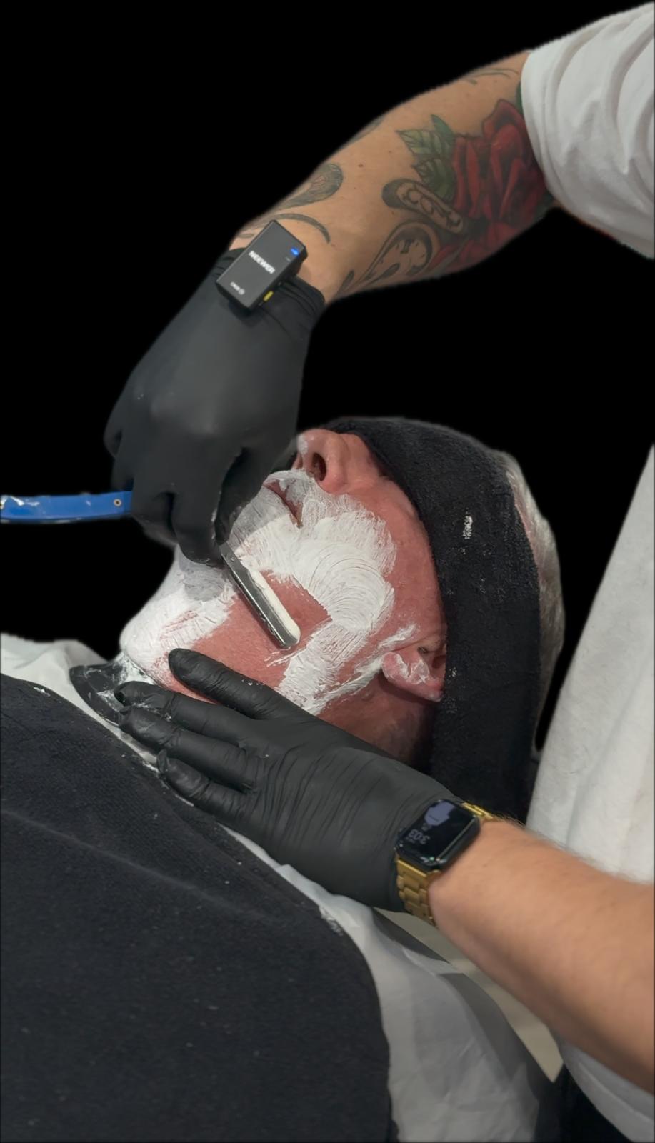 Premium straight razor shave at a charity grooming event