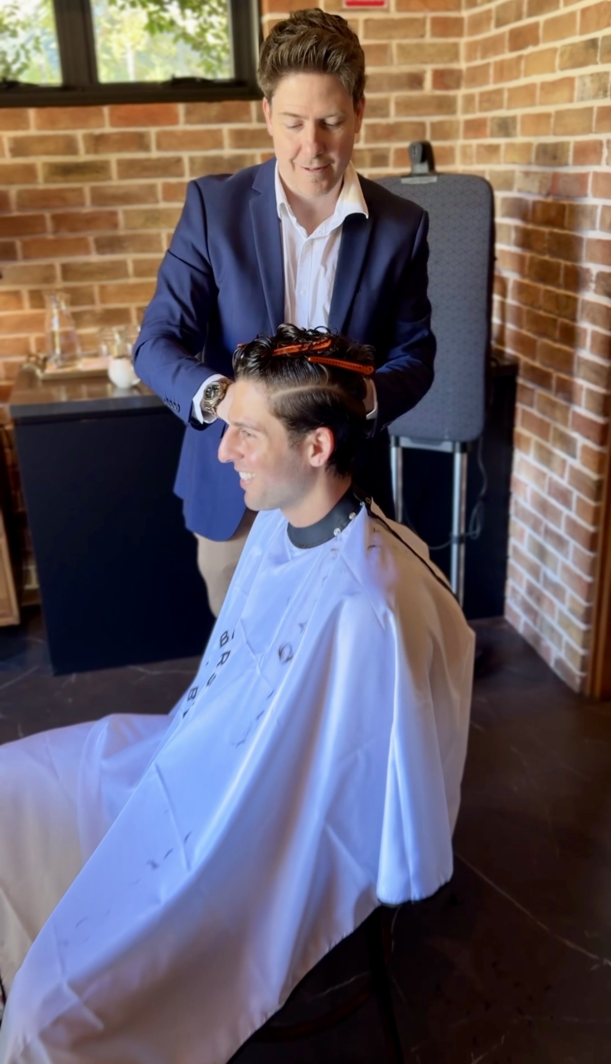 Barber of Belgium providing on-site grooming at an event